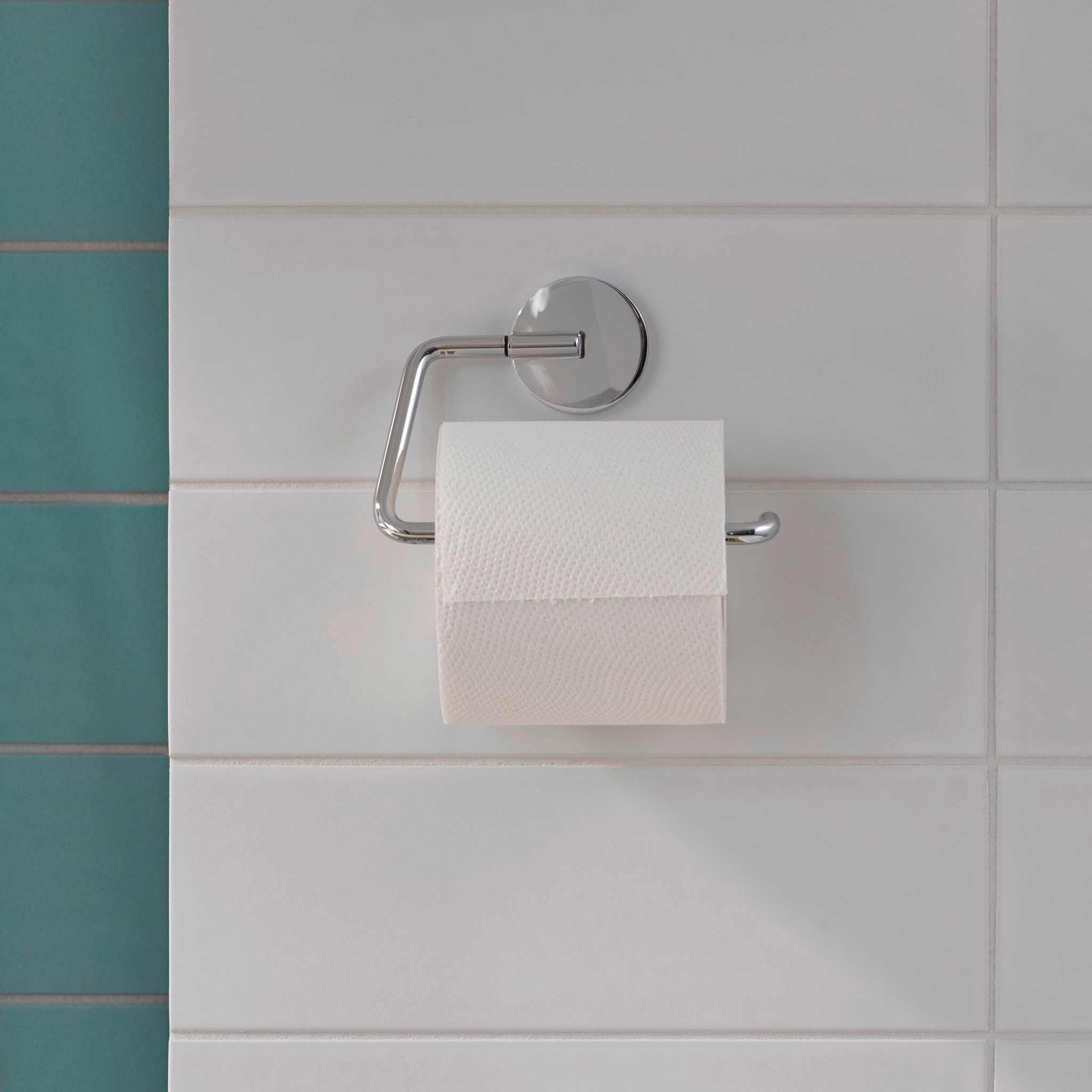 Round pappershållare med en toalettrulle.