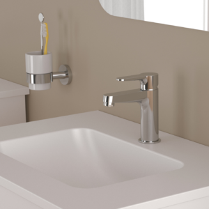 Garlate tvättställsblandare på ett tvättställ med en spegel ovanför.